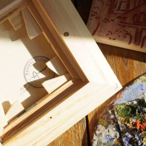 Rückseite von originalem Ölgemälde aus dem Aachener Stadtgarten mit Blick auf eine Brücke umgeben von herbstlichen Bäumen und einem Bach